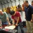 Andreas Varady Signs Benedetto Jazz Gtr Backs 9-27-12 while Bob Benedetto, Howard Paul and Vintner Dave Miner look on