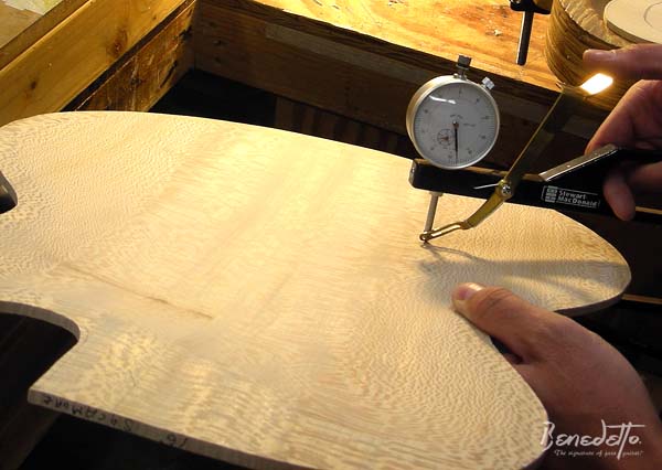 Damon Mailand uses a dial caliper to measure thicknesses of 16-B sycamore back Benedetto Guitars Savannah GA 6-25-13 
