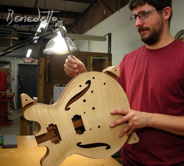 Luthier Kaleb Fitting measures a GA-35 Benedetto Guitars Savannah GA 7-31-14 news